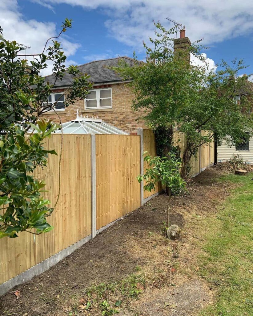 This is a photo of fence panels installed in a residential garden using concrete posts and gravel boards. Installed by Fast Fix Fencing Maidstone